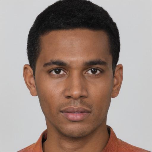 Neutral black young-adult male with short  black hair and brown eyes