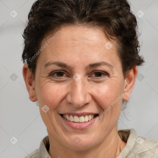 Joyful white adult female with short  brown hair and brown eyes