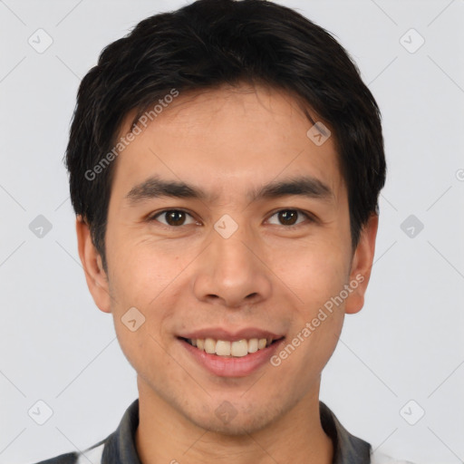 Joyful asian young-adult male with short  brown hair and brown eyes