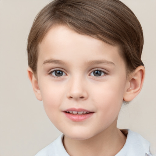 Joyful white child female with short  brown hair and brown eyes