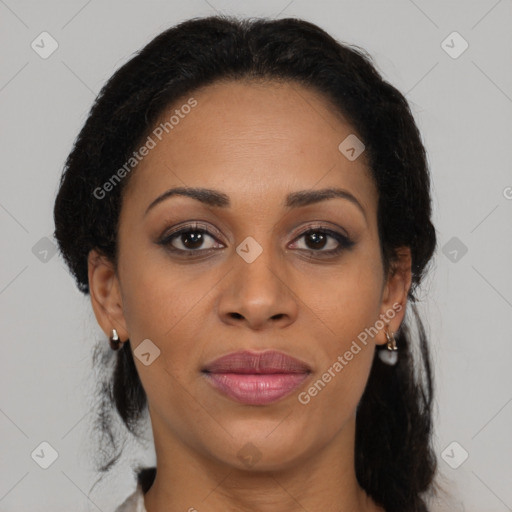 Joyful black adult female with medium  brown hair and brown eyes