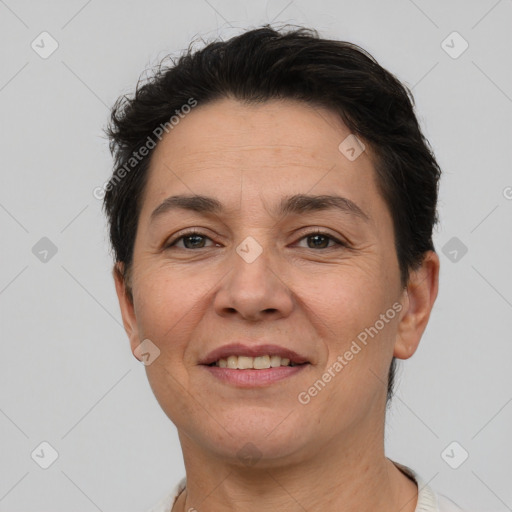 Joyful white adult female with short  brown hair and brown eyes