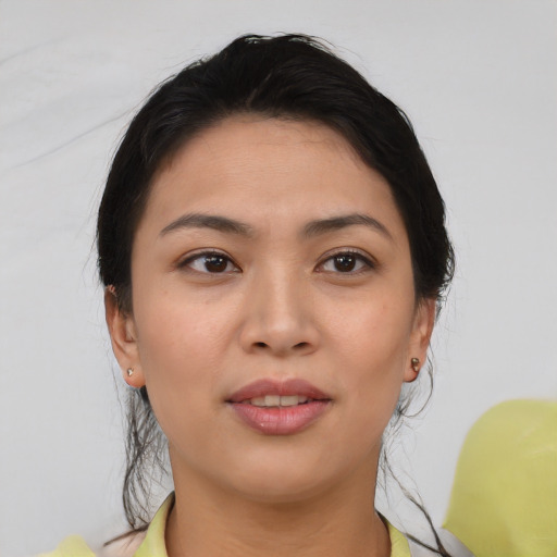 Joyful asian young-adult female with medium  brown hair and brown eyes