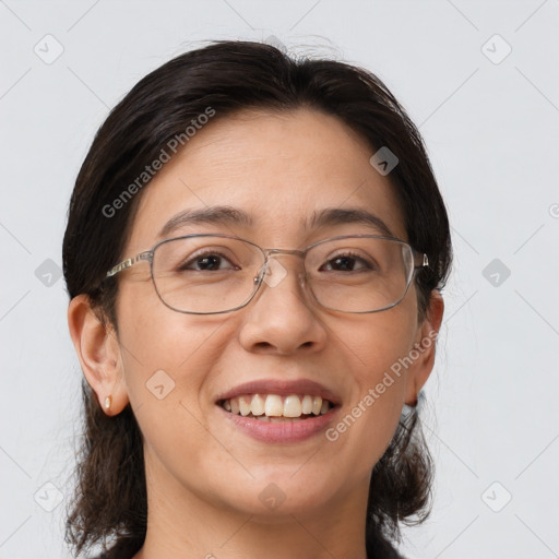 Joyful white adult female with medium  brown hair and brown eyes