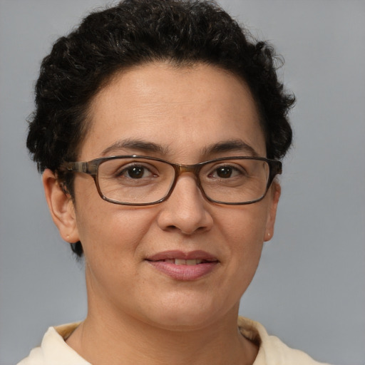 Joyful white adult female with short  brown hair and brown eyes