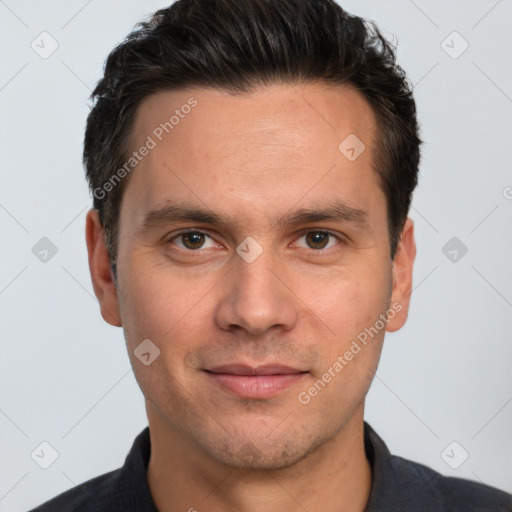 Joyful white adult male with short  brown hair and brown eyes