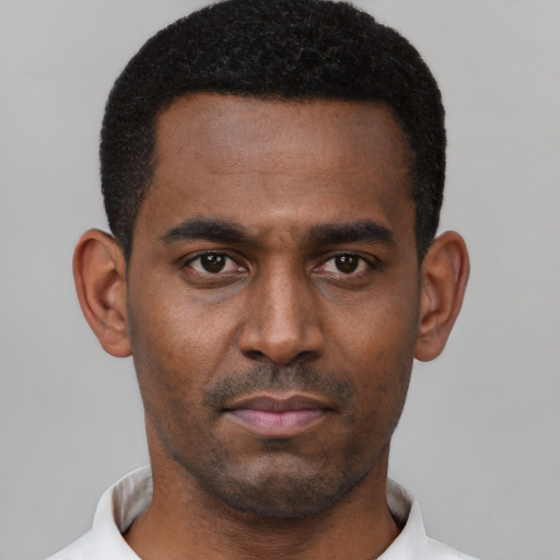 Neutral black young-adult male with short  black hair and brown eyes