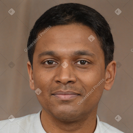 Joyful latino young-adult male with short  brown hair and brown eyes