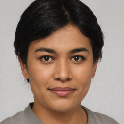 Joyful asian young-adult female with short  black hair and brown eyes