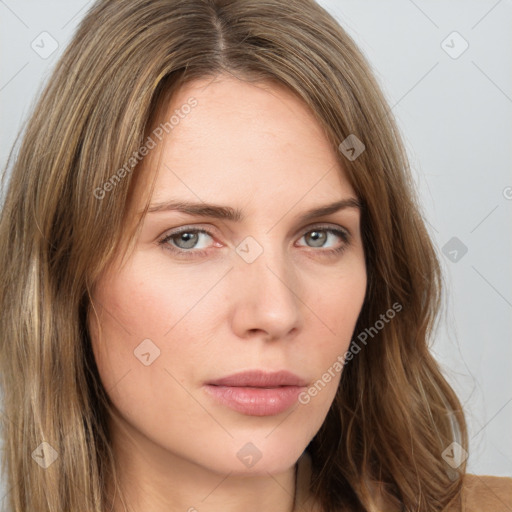 Neutral white young-adult female with long  brown hair and brown eyes