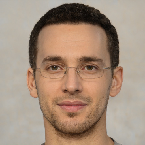 Joyful white adult male with short  brown hair and brown eyes