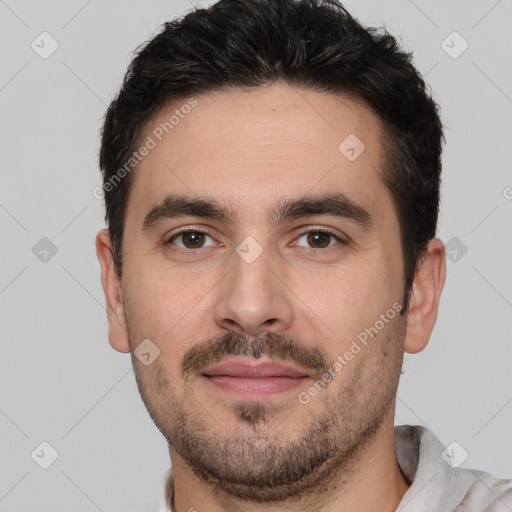 Joyful white young-adult male with short  black hair and brown eyes