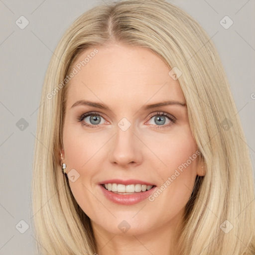 Joyful white young-adult female with long  brown hair and blue eyes