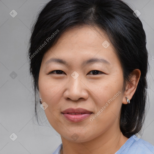 Joyful asian young-adult female with medium  brown hair and brown eyes