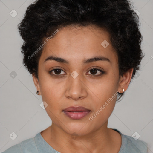 Joyful latino young-adult female with short  brown hair and brown eyes