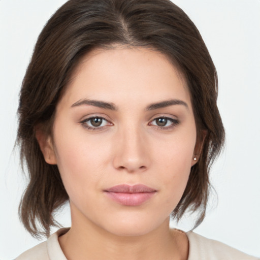 Neutral white young-adult female with medium  brown hair and brown eyes