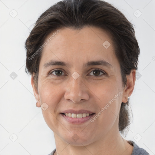 Joyful white adult female with medium  brown hair and brown eyes