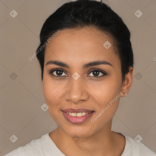 Joyful latino young-adult female with short  black hair and brown eyes