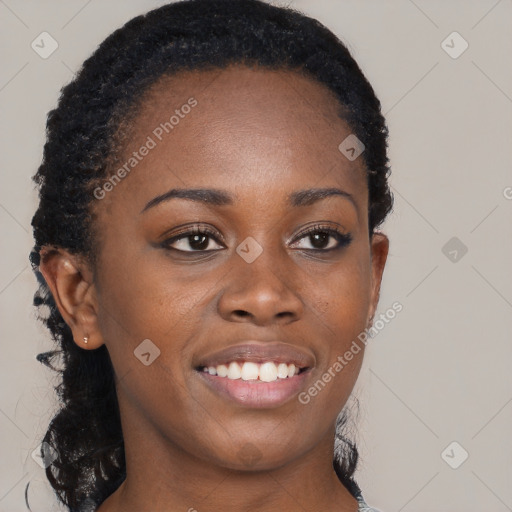 Joyful black young-adult female with long  brown hair and brown eyes