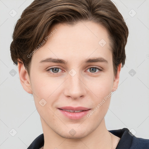 Joyful white young-adult female with short  brown hair and grey eyes