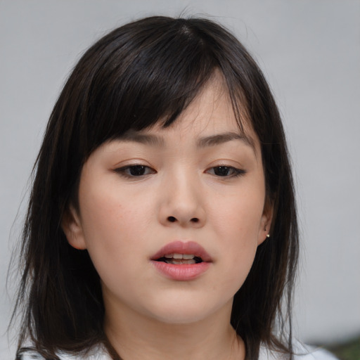 Neutral asian young-adult female with medium  brown hair and brown eyes