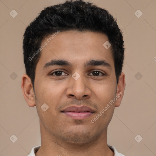 Joyful latino young-adult male with short  brown hair and brown eyes