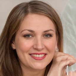 Joyful white young-adult female with medium  brown hair and brown eyes