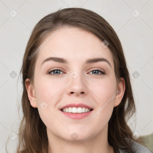 Joyful white young-adult female with long  brown hair and grey eyes