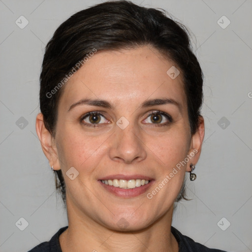 Joyful white adult female with medium  brown hair and brown eyes