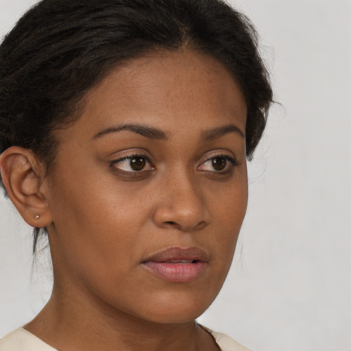 Neutral black young-adult female with short  brown hair and brown eyes