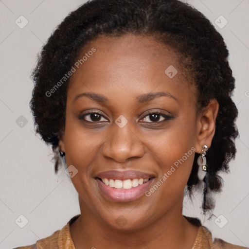 Joyful black young-adult female with long  brown hair and brown eyes