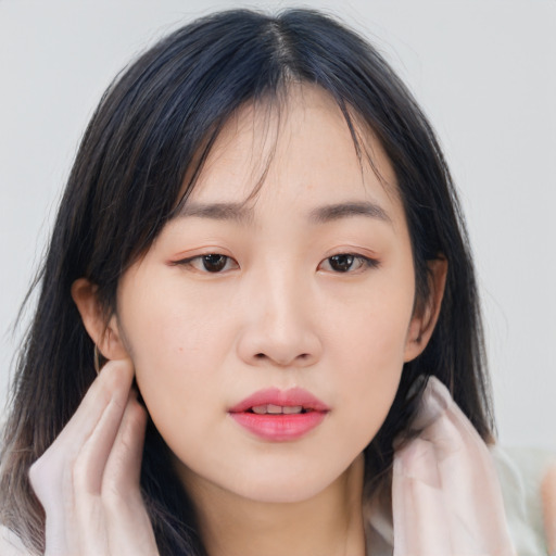 Neutral asian young-adult female with medium  black hair and brown eyes