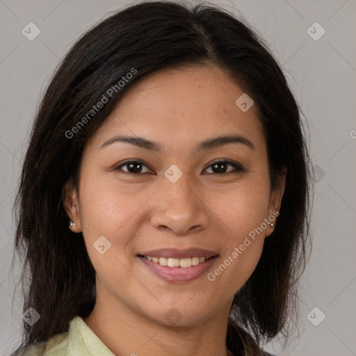 Joyful latino young-adult female with medium  brown hair and brown eyes