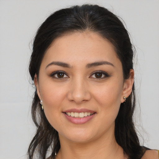 Joyful white young-adult female with long  brown hair and brown eyes