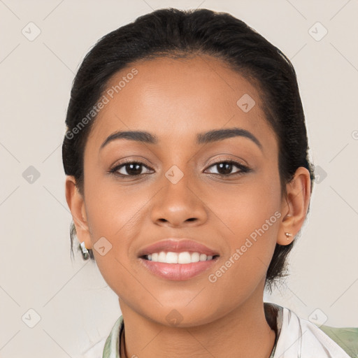 Joyful latino young-adult female with medium  brown hair and brown eyes