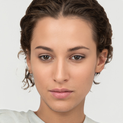 Neutral white young-adult female with short  brown hair and brown eyes