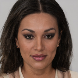 Joyful latino young-adult female with medium  brown hair and brown eyes