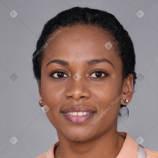 Joyful black young-adult female with short  black hair and brown eyes