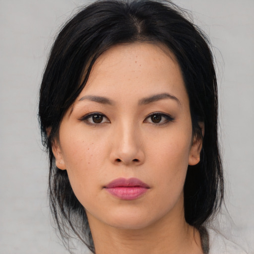 Neutral asian young-adult female with medium  black hair and brown eyes