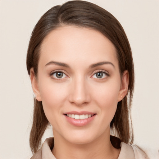 Joyful white young-adult female with medium  brown hair and brown eyes