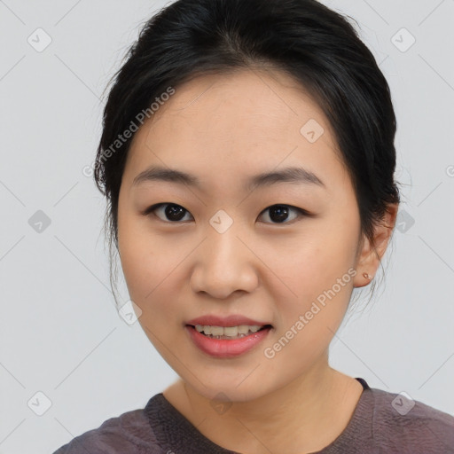 Joyful asian young-adult female with medium  black hair and brown eyes