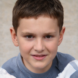 Joyful white child male with short  brown hair and brown eyes