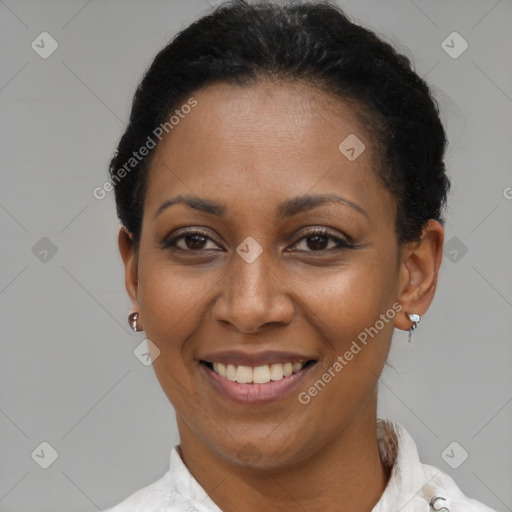 Joyful black adult female with short  brown hair and brown eyes