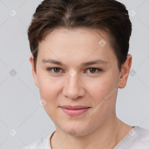 Joyful white young-adult female with short  brown hair and brown eyes