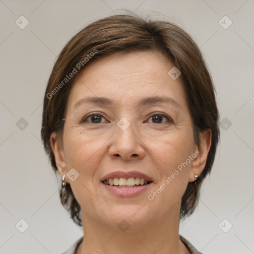 Joyful white adult female with medium  brown hair and brown eyes