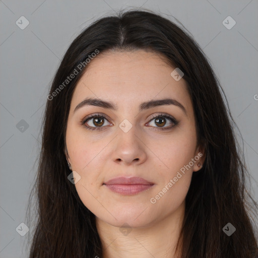 Joyful white young-adult female with long  brown hair and brown eyes