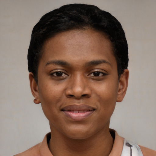 Joyful black young-adult female with short  black hair and brown eyes
