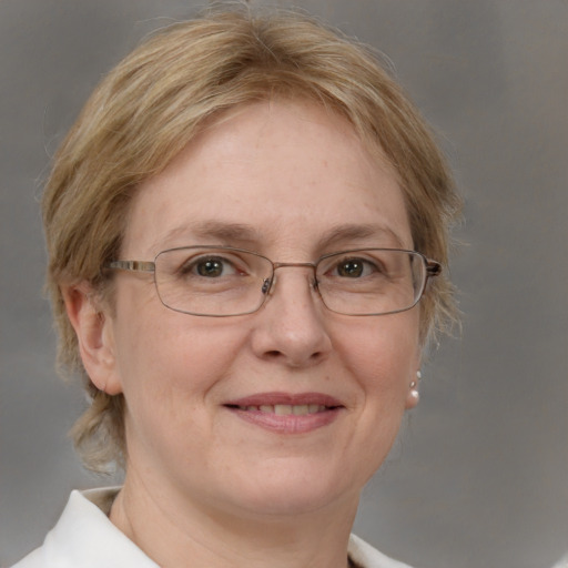 Joyful white middle-aged female with medium  brown hair and blue eyes