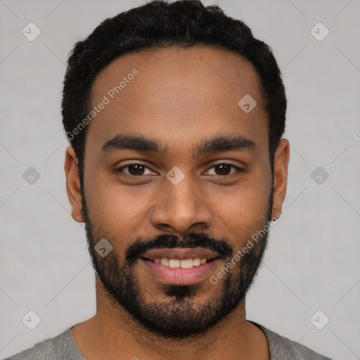 Joyful black young-adult male with short  black hair and brown eyes