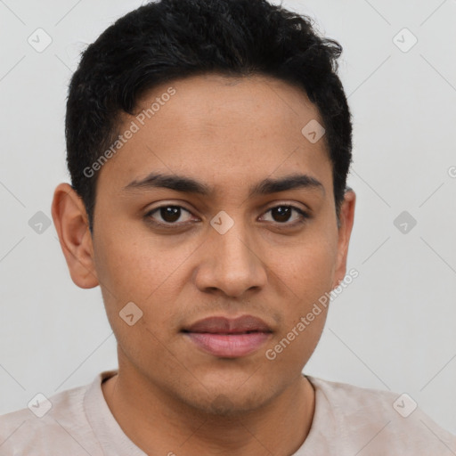 Joyful latino young-adult male with short  brown hair and brown eyes